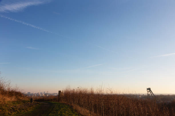 This hill once was a huge coal heap, after the end of coal mining it was transformed into a park, with view on the mine shaft and the city of Dortmund in a distance