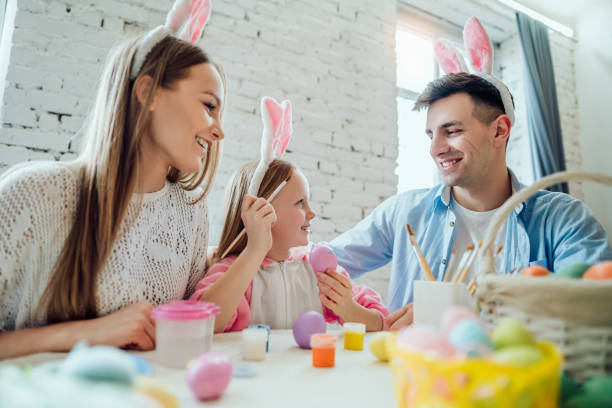 istock It's so interesting to paint Easter eggs with your family. 1134203825