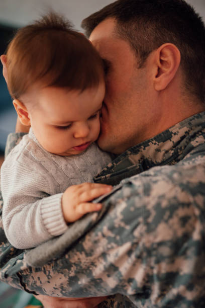 istock Military soldier kissing his son 1134204631