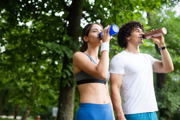 istock Happy young woman doing excercise outdoor in a park, jogging 1134214802