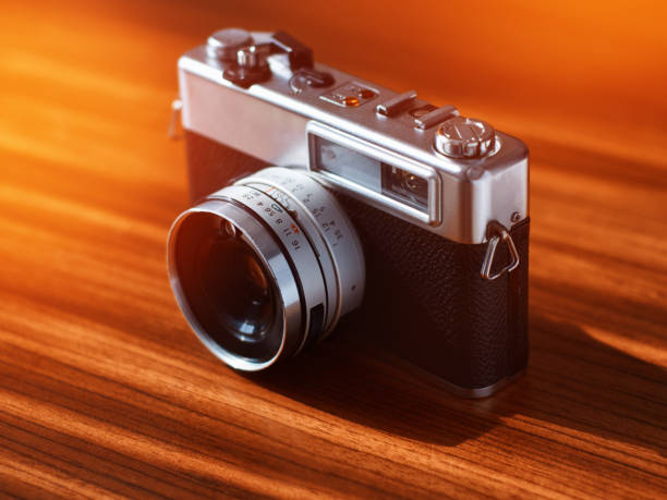 istock Rangefinder film camera on a wooden table 1134220011