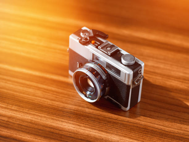 istock Rangefinder film camera on a wooden table 1134220236