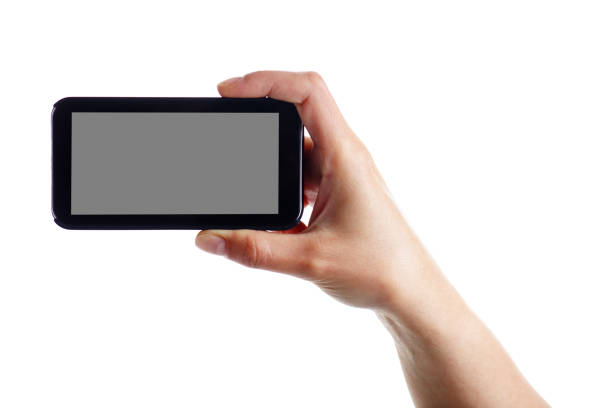 istock Holding a blank smartphone on white background 1134221135