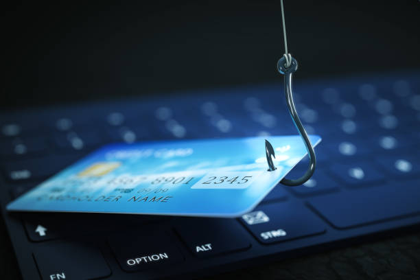 phishing credit card data with keyboard and hook symbol stock photo