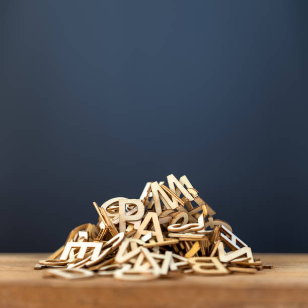 pile of wooden letters background stock photo