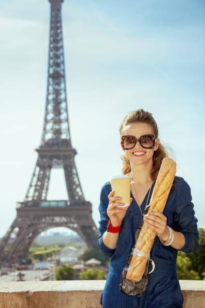 istock tourist woman with coffee cup and baguette having excursion 1134222579