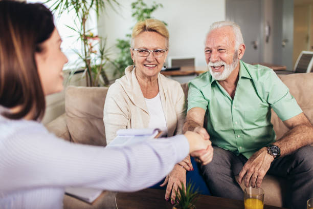 istock Positive aged couple consulting with insurance agent 1134227412
