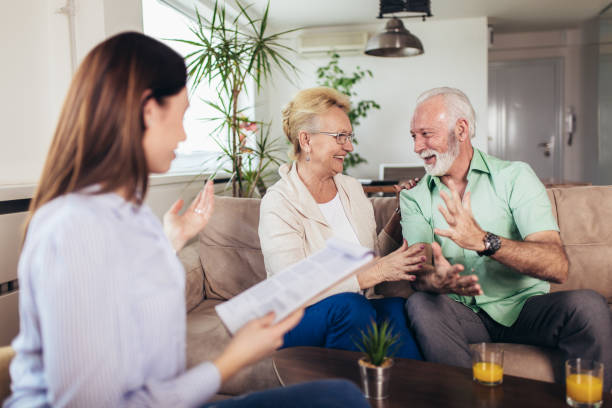 istock Positive aged couple consulting with insurance agent 1134227417