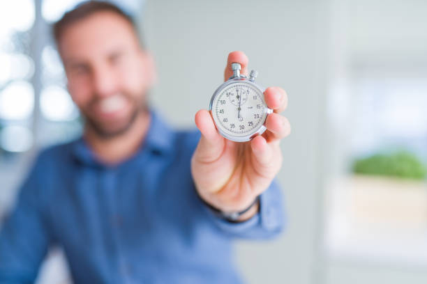 istock Handsome man showing stopwatch 1134227851