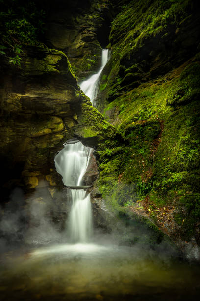istock Mystical Waterfall, with Mist and Moss, St Nectans Glen, North Cornwall 1134227989