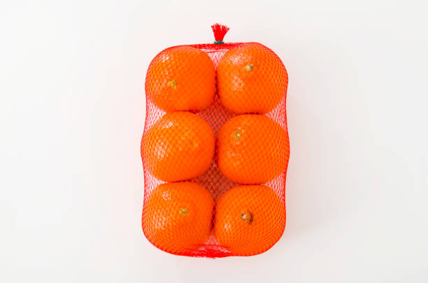 istock Fresh Minneola in plastic mesh sack on a white background,Called Honeybell also. 1134228914