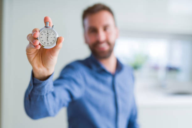 istock Handsome man showing stopwatch 1134229006