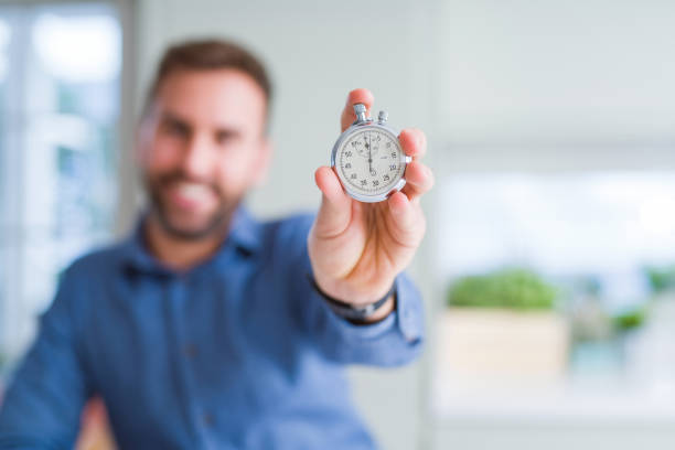 istock Handsome man showing stopwatch 1134229133