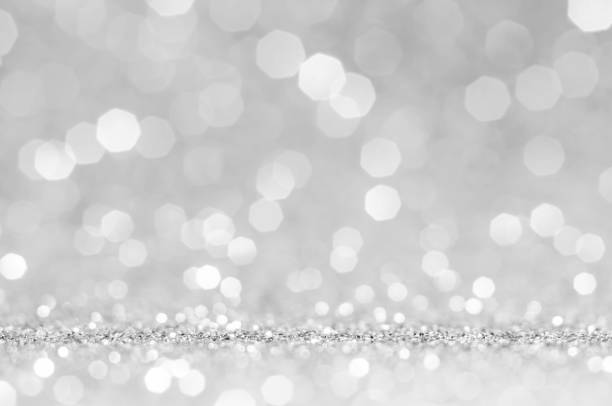 istock White or light grey bokeh,circle abstract light background,Light grey shining lights, sparkling glittering Valentines day,women day or event lights romantic backdrop.Blurred abstract holiday background. 1134231481