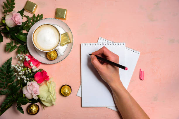 istock Cup of coffee with flowers on pink 1134232960