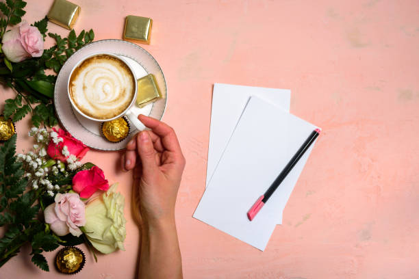 istock Cup of coffee with flowers on pink 1134233057