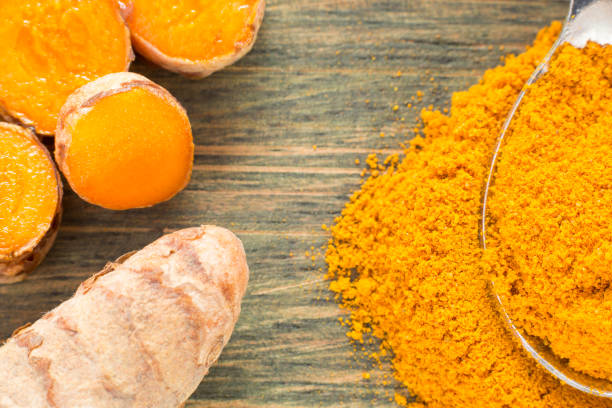 istock Turmeric powder and fresh turmeric. Curcuma longa 1134233076