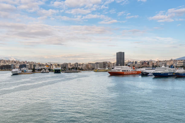 Piraeus, Greece - November 1, 2017: Port of Piraeus and cityscape of Athens, Greece. The port of Piraeus is the largest passenger port in Europe and the third largest in the world.