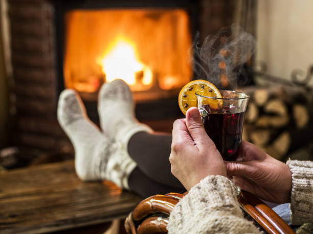 istock Hot mulled wine and book in woman hands. 1134235080