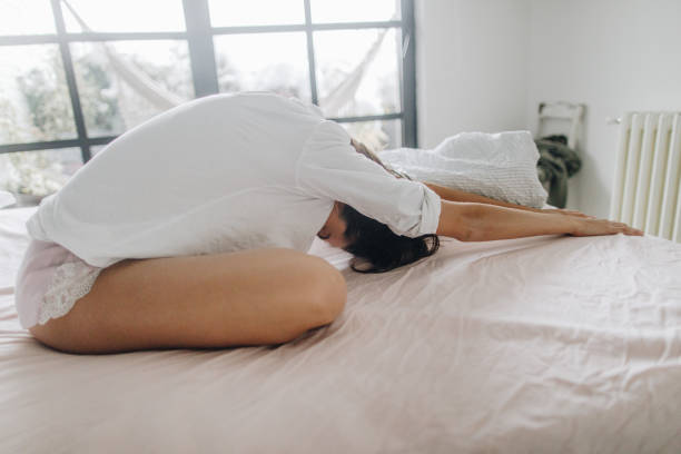 istock Young woman waking up 1134235107