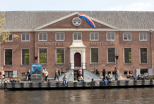 Amsterdam, Netherlands - April 20, 2017: Tourists outside the Hermitage Amsterdam, the Netherlands