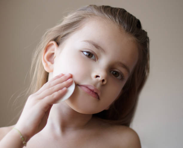 istock Little girl cleaning her face. 1134236716