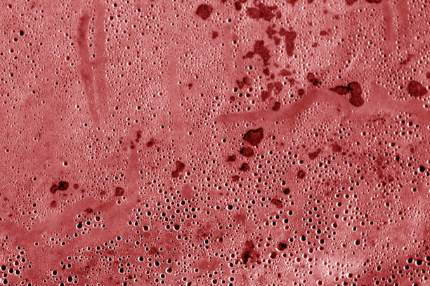 istock Wet plastic transparent old wrap texture in red tone. 1134237974