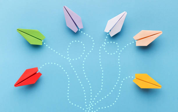 istock Paper planes with route trace on blue background 1134238793