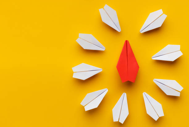 istock Red paper plane surrounded by white ones 1134238824
