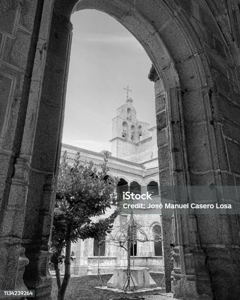 Church Tower Through Arch At Ávila Spain Stock Photo - Download Image Now - Ancient, Arch - Architectural Feature, Architecture