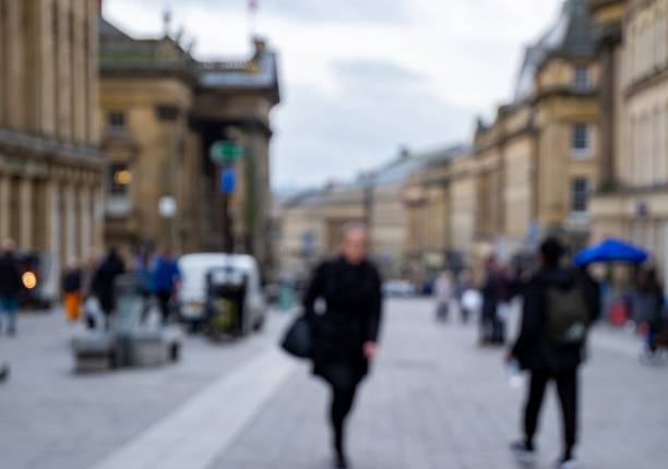 istock Defocused Image of People Walking the Streets 1134242415