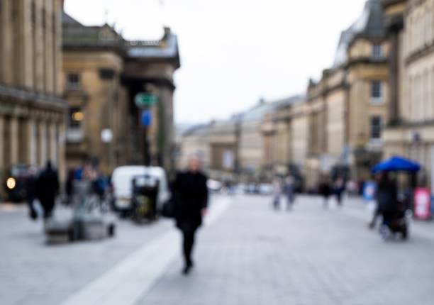 istock Defocused Image of People Walking the Streets 1134242472