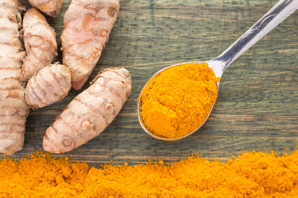 istock Turmeric powder and fresh turmeric. Curcuma longa 1134242563