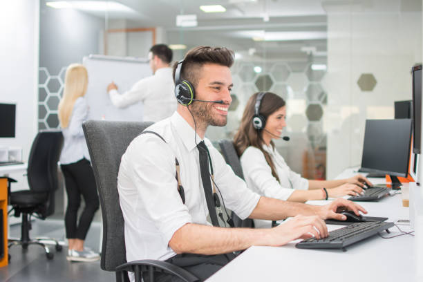 istock Cheerful customer service agents working in call center 1134246014