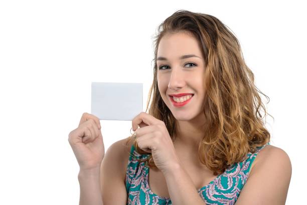 istock pretty young woman showing a small empty card 1134246066