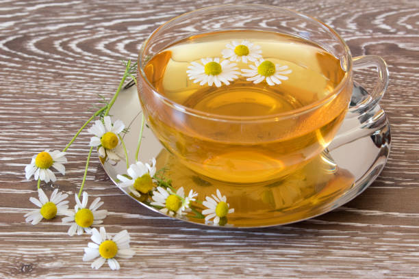 istock cup of chamomile tea with fresh blossoms 1134246405