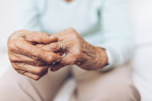 istock Heartbroken elderly woman holding a wedding ring 1134247253