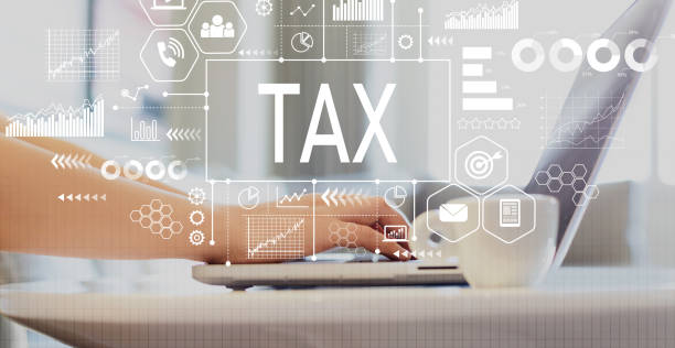 istock Tax with woman using a laptop 1134247943