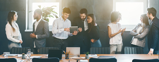 Business people discussing strategies during break at meeting in office