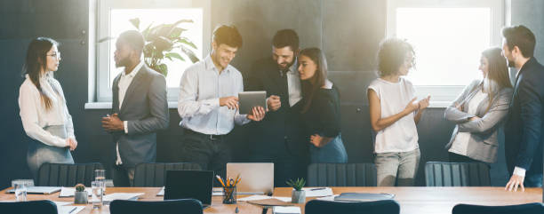 business people discussing strategies during break in office - blackboard teamwork team business imagens e fotografias de stock