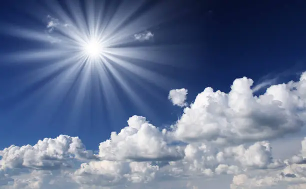 Photo of white fluffy clouds in the blue sky