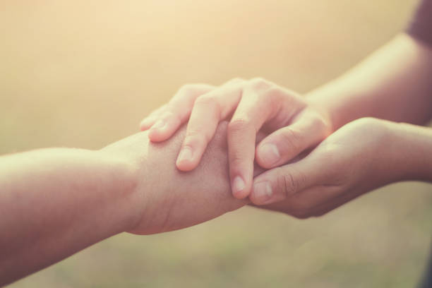istock people old and young hand holding hope 1134251335