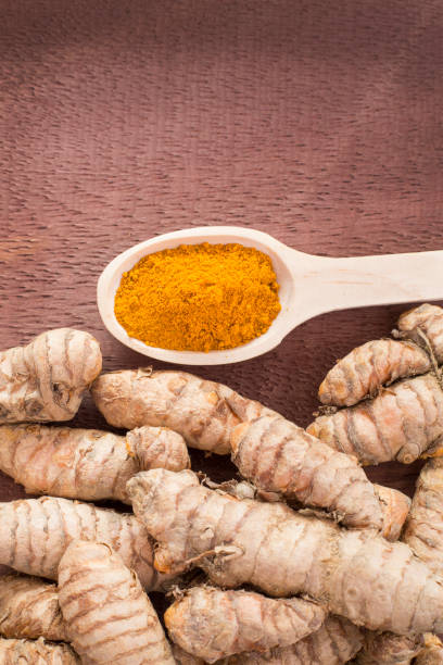 istock Turmeric powder and fresh turmeric. Curcuma longa 1134253316