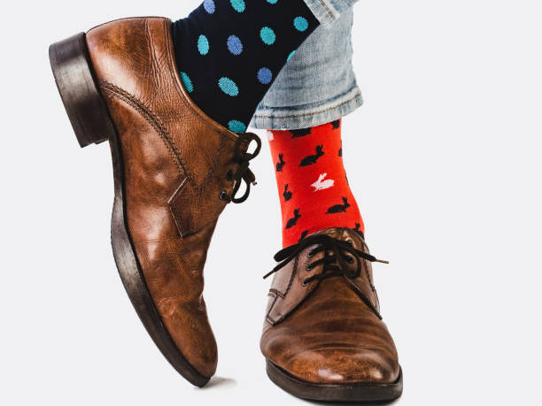 istock Office Manager in stylish shoes and bright socks 1134254333