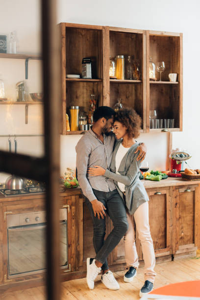 istock Loving african-american couple embracing in kitchen, copy space 1134255098