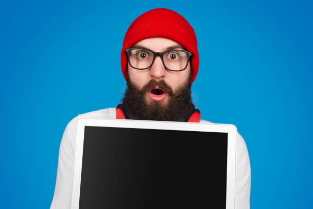 istock Shocked hipster demonstrated tablet 1134255263