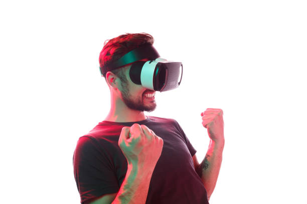 istock Content man in VR glasses celebrating win 1134255305