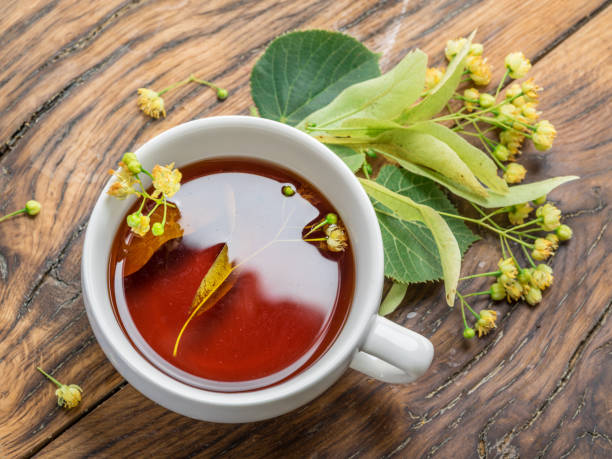 istock Cup of linden tea and lime flowers. 1134255735