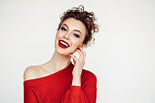 Beautiful woman. Red sweater and red lipstick.