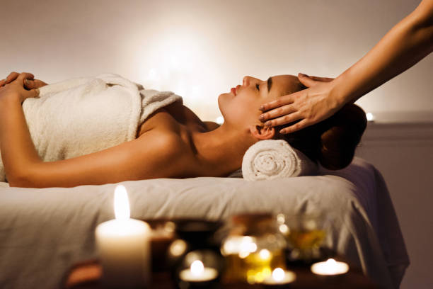 istock Young girl having face massage, relaxing in spa salon 1134260964
